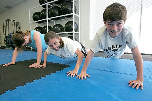 BORIS MINKEVICH / WINNIPEG FREE PRESS  060516 Angela MacKenzie,12, Leah Kerger,11, and Ian MacKenzie,10, do some excercises in a fitness program.