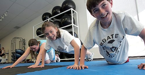 BORIS MINKEVICH / WINNIPEG FREE PRESS  060516 Angela MacKenzie,12, Leah Kerger,11, and Ian MacKenzie,10, do some excercises in a fitness program.