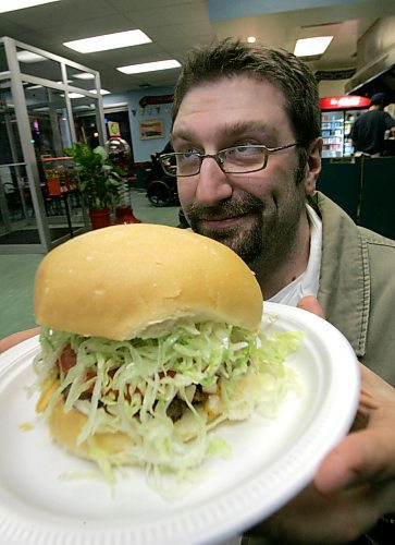 BORIS MINKEVICH / WINNIPEG FREE PRESS  060502 Burger man Angelo De Francesco with a fine burger. He has a blog on Winnipeg hamburgers.