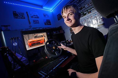 JOHN WOODS / WINNIPEG FREE PRESS
Carter Friesen, 16, is photographed in his bedroom with his computer system and the Nascar car he designed Tuesday, October 26, 2021 in Winnipeg. Friesen has impressed some executives involved with Nascar and has been invited to take in a race and meet the execs this weekend.

Reporter: Taylor