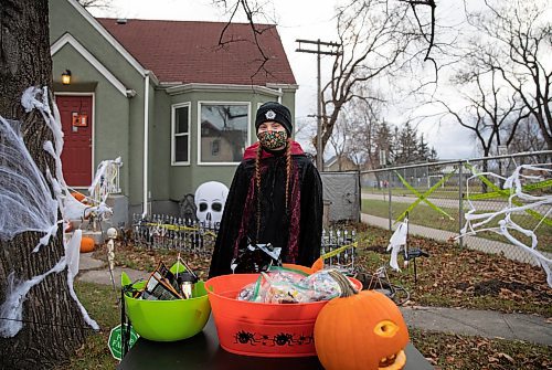 JESSICA LEE / WINNIPEG FREE PRESS

Jaclynne Green poses for a photo at her home in Elmwood on October 31, 2021. She and her partner have prepackaged their treats for neighbourhood children and decorated their house a few weeks before Halloween. 








