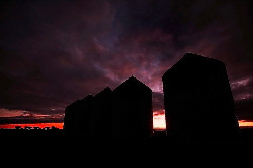 JOHN WOODS / WINNIPEG FREE PRESS
A truck on the Transcanada passes some grain silos just outside Headingley as the sun sets Monday, November 1, 2021. 

Reporter: standup