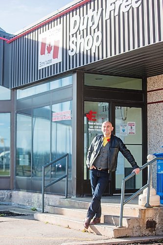 MIKAELA MACKENZIE / WINNIPEG FREE PRESS

Simon Resch, owner of the Duty Free Shop, poses for a portrait on the first day the US border opened to Canadians since March 2020 at Emerson on Monday, Nov. 8, 2021. For Malak story.
Winnipeg Free Press 2021.