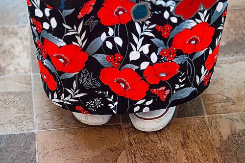 Daniel Crump / Winnipeg Free Press. A young indigenous woman wears a ribbon skirt featuring poppies during the Manitoba Indigenous Veterans Inc. virtual commemoration event for National Indigenous Veterans Day at Thunderbird House in Winnipeg. November 8, 2021.