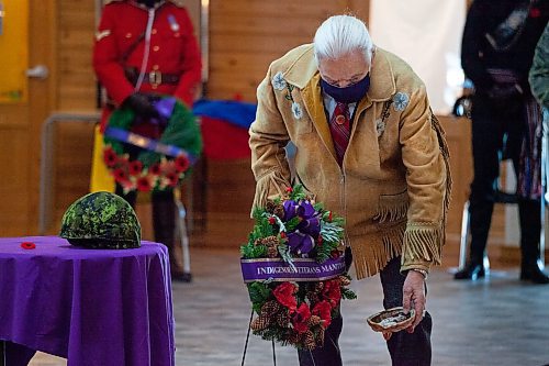 Daniel Crump / Winnipeg Free Press. Elder Dr. Winston Wiuttenee places a wreath during the Manitoba Indigenous Veterans Inc. virtual commemoration event for National Indigenous Veterans Day at Thunderbird House in Winnipeg. November 8, 2021.
