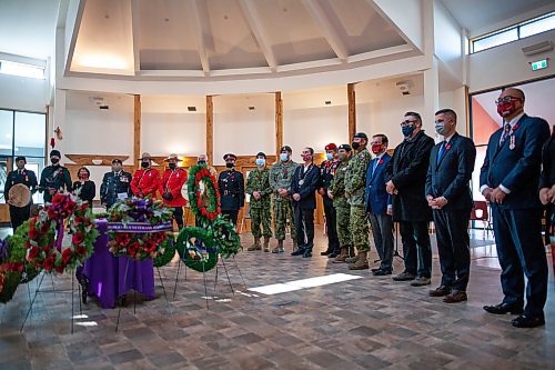 Daniel Crump / Winnipeg Free Press. Attendees and honoured guests stand during the Manitoba Indigenous Veterans Inc. virtual commemoration event for National Indigenous Veterans Day at Thunderbird House in Winnipeg. November 8, 2021.
