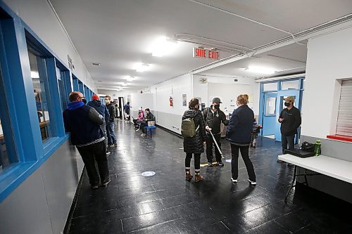 JOHN WOODS / WINNIPEG FREE PRESS
Trish Buhler, hockey mum and manager of St Boniface Seals, scans the vaccination card of people as they enter the Bertrand Arena on Tuesday, November 9, 2021. Shaun Chornley, the president of the St Boniface Minor Hockey Association, and others feel that using volunteers to scan vaccination cards at city arenas is risky.

Re: Pursaga