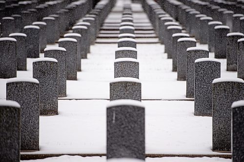 Mike Sudoma / Winnipeg Free Press
Snow lies on the tops of headstones in the Field of Honour during a Remembrance Day service at brookside Cemetery Thursday morning
November 11, 2021