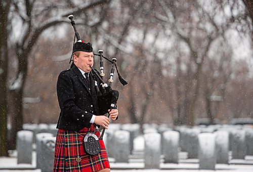 Mike Sudoma / Winnipeg Free Press
Piper, Nathan Mitchell, plays his bagpipes as he walks  through the Field of Honour to take his post in front of the Stone of Remembrance during a Remembrance Day service at brookside Cemetery Thursday morning
November 11, 2021