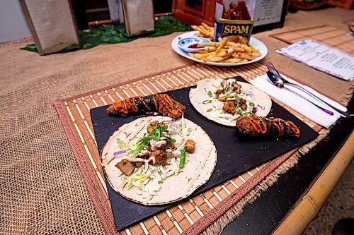 Mike Sudoma / Winnipeg Free Press
A freshly served dish of Sisig Taco and Mochiko Chicken at Barn Manila Nights Wednesday evening
November 10, 2021