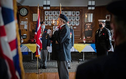 JESSICA LEE / WINNIPEG FREE PRESS

Ron Mazurat blows out a torch at Elmwood Legion on November 11, 2021 for Remembrance Day ceremonies.






