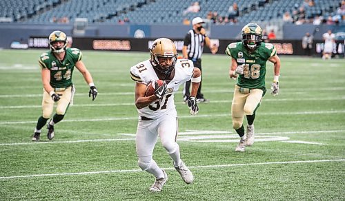 MIKE SUDOMA / Winnipeg Free Press

Bisons running back, Victor St. Pierre-Laviolette makes his past Regina Rams defence to score a 2pt conversion during the Bisons home opener Saturday

September 25, 2021