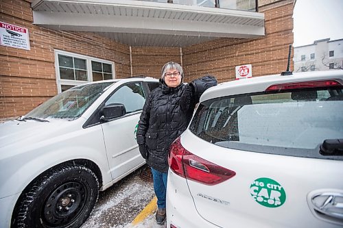 MIKAELA MACKENZIE / WINNIPEG FREE PRESS

Louella Lester, Peg City Car Co-op user, poses for a portrait with one of the cars in Osborne Village on Wednesday, Nov. 17, 2021. For Janine LeGal story.
Winnipeg Free Press 2021.