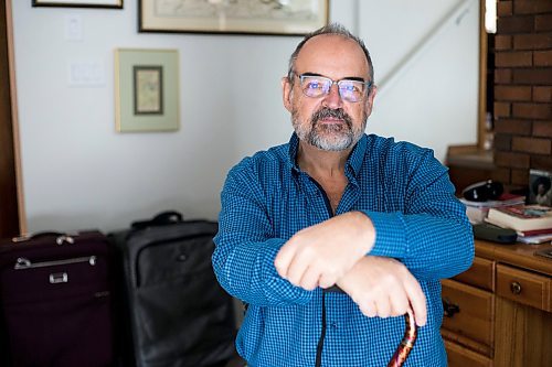 MIKAELA MACKENZIE / WINNIPEG FREE PRESS

Max Johnson poses for a portrait in his home (with the suitcases from travelling) after coming back from Lithuania, where he went to get knee surgery, in Winnipeg on Wednesday, Nov. 17, 2021. For Kevin story.
Winnipeg Free Press 2021.