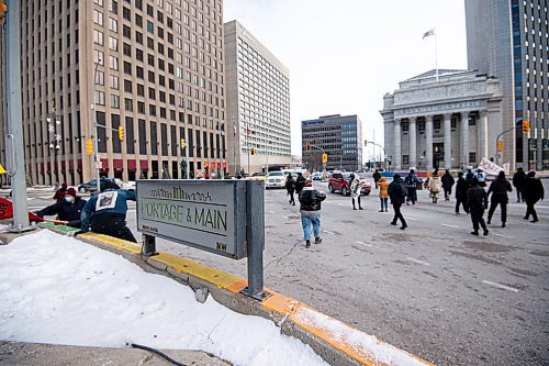 Mike Sudoma / Winnipeg Free Press
Protestors jump down from a barricade at Portage and Main as the &#x201c;All Out for WedzinKwa&#x201d; rally begins Friday afternoon
November 19, 2021