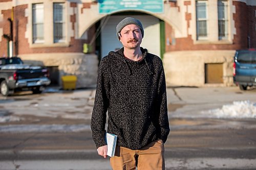 MIKAELA MACKENZIE / WINNIPEG FREE PRESS

Free Press reporter Ryan Thorpe poses for a portrait in front of the Minto Armoury, where Patrik Mathews was at one point stationed, in Winnipeg on Friday, Nov. 19, 2021. For Ryan Thorpe story.
Winnipeg Free Press 2021.