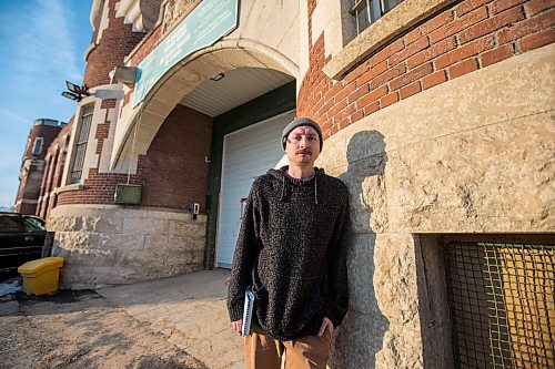 MIKAELA MACKENZIE / WINNIPEG FREE PRESS

Free Press reporter Ryan Thorpe poses for a portrait in front of the Minto Armoury, where Patrik Mathews was at one point stationed, in Winnipeg on Friday, Nov. 19, 2021. For Ryan Thorpe story.
Winnipeg Free Press 2021.