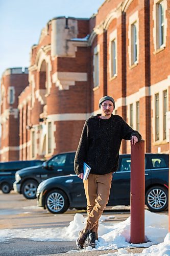 MIKAELA MACKENZIE / WINNIPEG FREE PRESS

Free Press reporter Ryan Thorpe poses for a portrait in front of the Minto Armoury, where Patrik Mathews was at one point stationed, in Winnipeg on Friday, Nov. 19, 2021. For Ryan Thorpe story.
Winnipeg Free Press 2021.