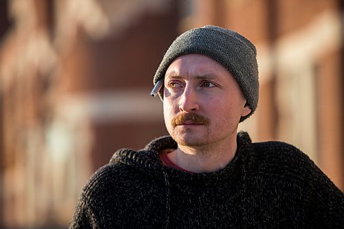 MIKAELA MACKENZIE / WINNIPEG FREE PRESS

Free Press reporter Ryan Thorpe poses for a portrait in front of the Minto Armoury, where Patrik Mathews was at one point stationed, in Winnipeg on Friday, Nov. 19, 2021. For Ryan Thorpe story.
Winnipeg Free Press 2021.