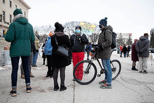 JESSICA LEE / WINNIPEG FREE PRESS

Jesse Hajer holds at sign at the Manitoba Legislative Building on November 22, 2021, where a Right to Housing rally was held to call on Premier Stefanson to commit to building 300 new units of rent geared to income housing.










