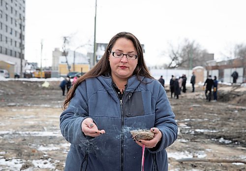 JESSICA LEE / WINNIPEG FREE PRESS

Jamie Grasby, a knowledge keeper, blesses the site at 390 Ross Ave by smudging on November 22, 2021. Home First Winnipeg Inc is building a 47-unit apartment for those at risk of becoming homeless.

