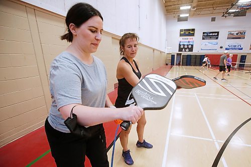 JOHN WOODS / WINNIPEG FREE PRESS
Winnipeg Free Press reporter Jen Zoratti, left, learns how to play pickleball from Rose Sawatzky, president of Pickleball Manitoba and National Championship silver medalist, at Sturgeon Heights Community Centre  on Tuesday, November 23, 2021. 

Re: zoratti