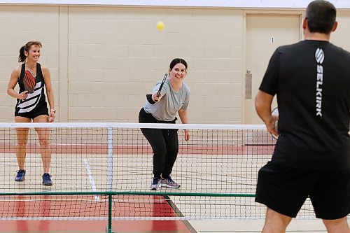 JOHN WOODS / WINNIPEG FREE PRESS
Winnipeg Free Press reporter Jen Zoratti, right, learns how to play pickleball from Rose Sawatzky, president of Pickleball Manitoba and National Championship silver medalist, as she hits the ball back to Damien Rondeau, national 35+ 4.0 category champion, at Sturgeon Heights Community Centre  on Tuesday, November 23, 2021. 

Re: zoratti