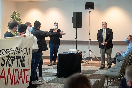 Mike Sudoma / Winnipeg Free Press
Student representatives hold up a sign reading “Profs Over Profit. Stop The Mandate” while voicing concerns over educational finances and the current University of Manitoba Strike in the midst of Finance Minister, Scott Fielding’s 2022 Budget Consultation at the RBC Convention Centre Monday evening.
November 29, 2021
