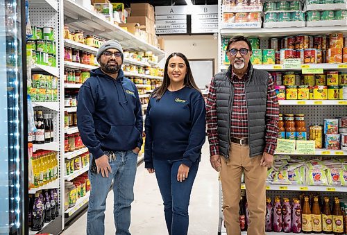 JESSICA LEE / WINNIPEG FREE PRESS

Dinu Tailor (right), owner of Dino&#x2019;s Grocery Mart, is photographed at his store with daughter Neeti Varma and son-in-law Rajan Varma on November 30, 2021.

Reporter: Dave














