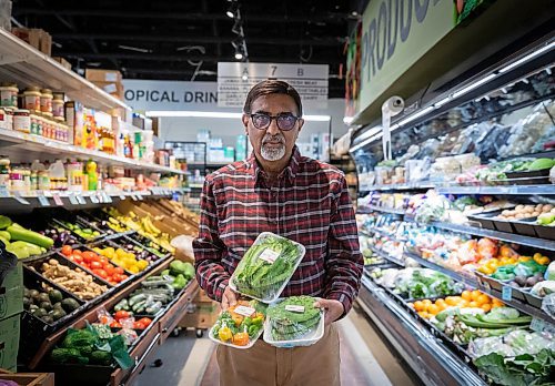 JESSICA LEE / WINNIPEG FREE PRESS

Dinu Tailor, owner of Dino&#x2019;s Grocery Mart, is photographed at his store holding specialty produce items on November 30, 2021.

Reporter: Dave













