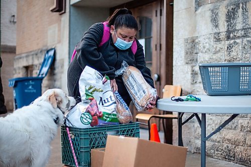 Daniel Crump / Winnipeg Free Press. Rina Hermkens, who is both a volunteer and user of Winnipeg Harvest food banks, picks up food at Home Street Mennonite Church,&#xa0;318 Home Street. December 1, 2021.