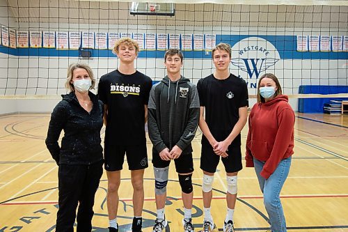 Mike Sudoma / Winnipeg Free Press
(Left to right) Assistant Coach, Lorriann Ludwig, Dylan Martens, Rowan Krahn, Sammy Ludwig, and head coach Maiya Westwood of the Westgate Wings Varsity Boys volleyball team during practice Thursday night 
December 2, 2021