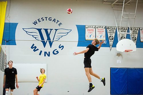Mike Sudoma / Winnipeg Free Press
Dylan Martens of the Westgate Wings Varsity Boys volleyball team reaches swings for a hit during practice Thursday night 
December 2, 2021