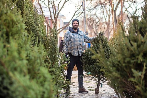 MIKAELA MACKENZIE / WINNIPEG FREE PRESS

Robin Bryan poses for a portrait with Christmas trees at Pete's Trees in Winnipeg on Friday, Dec. 3, 2021. For Martin Cash story.
Winnipeg Free Press 2021.