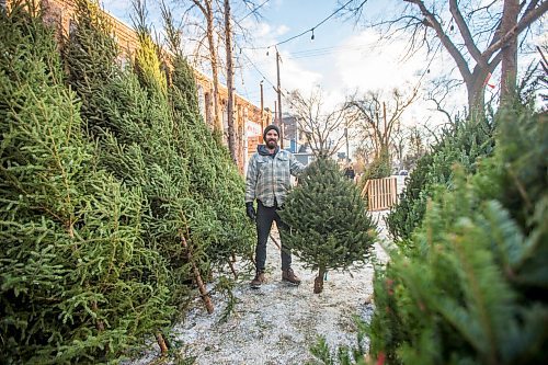 MIKAELA MACKENZIE / WINNIPEG FREE PRESS

Robin Bryan poses for a portrait with Christmas trees at Pete's Trees in Winnipeg on Friday, Dec. 3, 2021. For Martin Cash story.
Winnipeg Free Press 2021.