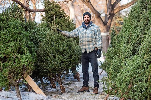 MIKAELA MACKENZIE / WINNIPEG FREE PRESS

Robin Bryan poses for a portrait with Christmas trees at Pete's Trees in Winnipeg on Friday, Dec. 3, 2021. For Martin Cash story.
Winnipeg Free Press 2021.