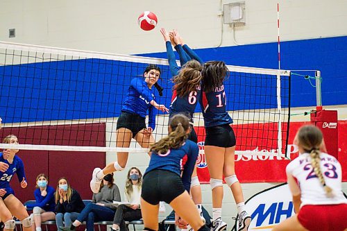 Daniel Crump / Winnipeg Free Press. JH Bruns Broncos left side Raya Surinx spikes the ball during the AAAA Provincial High School Girl&#x573; Volleyball championships between against the St. Mary&#x573; Flames at Sturgeon Heights Collegiate in Winnipeg, Saturday evening. December 4, 2021.