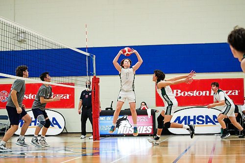 Daniel Crump / Winnipeg Free Press. Vincent Massey Trojans setter Cole McQueen sets the ball during the AAAA Provincial High School Boy&#x573; Volleyball championships against the Westgate Wings at Sturgeon Heights Collegiate in Winnipeg, Saturday evening. December 4, 2021.