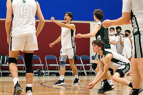 Daniel Crump / Winnipeg Free Press. The Vincent Massey Trojans celebrate a point during the AAAA Provincial High School Boy&#x573; Volleyball championships against the Westgate Wings at Sturgeon Heights Collegiate in Winnipeg, Saturday evening. December 4, 2021.