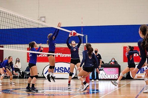 Daniel Crump / Winnipeg Free Press. St. Mary&#x573; Flames setter Elle Wood sets the ball during the AAAA Provincial High School Girl&#x573; Volleyball championships between against the JH Bruns Broncos at Sturgeon Heights Collegiate in Winnipeg, Saturday evening. December 4, 2021.