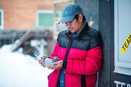 MIKAELA MACKENZIE / WINNIPEG FREE PRESS

Ivan Reyes poses for a portrait with a racing pigeon at the Team Reyes loft in Winnipeg on Friday, Nov. 26, 2021. For Ben Waldman story.
Winnipeg Free Press 2021.