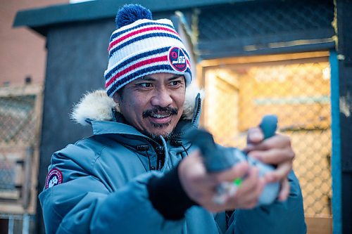 MIKAELA MACKENZIE / WINNIPEG FREE PRESS

Angelo Reyes poses for a portrait with a racing pigeon at the Team Reyes loft in Winnipeg on Friday, Nov. 26, 2021. For Ben Waldman story.
Winnipeg Free Press 2021.