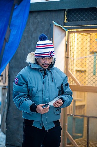 MIKAELA MACKENZIE / WINNIPEG FREE PRESS

Angelo Reyes poses for a portrait with a racing pigeon at the Team Reyes loft in Winnipeg on Friday, Nov. 26, 2021. For Ben Waldman story.
Winnipeg Free Press 2021.