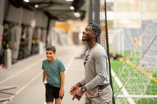Mike Sudoma / Winnipeg Free Press

Instructor, Wilfred Sam-King, shares a laugh with the kids in the in the Athletics Manitoba track and field program Tuesday night at the Axworthy Health and Recplex

November 2, 2021