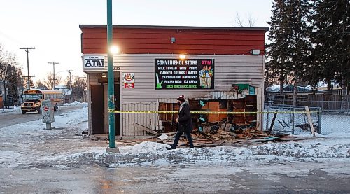 MIKE DEAL / WINNIPEG FREE PRESS
Debris from an early morning fire at Strikers Deli and Meats at 832 Burrows Avenue litters the sidewalk Tuesday morning.
211207 - Tuesday, December 07, 2021.