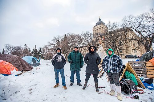 MIKAELA MACKENZIE / WINNIPEG FREE PRESS

John Butler (left), Willie Nicholas, Aaliyah Leach, and Tyler Dodge pose for a photo at the encampment on the legislative grounds in Winnipeg on Tuesday, Dec. 7, 2021. For Malak story.
Winnipeg Free Press 2021.