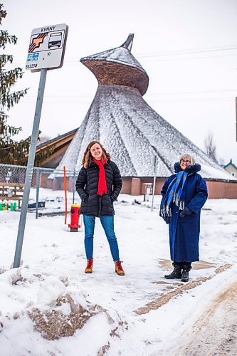 MIKAELA MACKENZIE / WINNIPEG FREE PRESS

Julie Penner, audio producer, and Susan Algie, executive director of the Winnipeg Architecture Foundation, pose for a portrait at a #10 bus stop in front of Precious Blood church in Winnipeg on Wednesday, Dec. 8, 2021. The two worked on Archi10, a new app that delivers an audio tour of local buildings while travelling along the #10 bus route. For Eva story.
Winnipeg Free Press 2021.