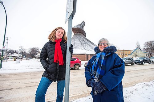 MIKAELA MACKENZIE / WINNIPEG FREE PRESS

Julie Penner, audio producer, and Susan Algie, executive director of the Winnipeg Architecture Foundation, pose for a portrait at a #10 bus stop in front of Precious Blood church in Winnipeg on Wednesday, Dec. 8, 2021. The two worked on Archi10, a new app that delivers an audio tour of local buildings while travelling along the #10 bus route. For Eva story.
Winnipeg Free Press 2021.