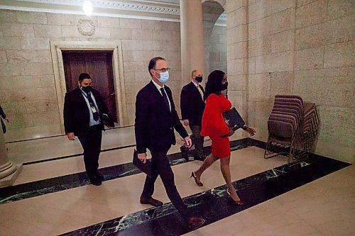 Daniel Crump / Winnipeg Free Press. Dr. Peter MacDonald, Health and Seniors Care Minister Audrey Gordon, and Matthew Lister make their way to a health announcement in the rotunda at the Manitoba legislative building in Winnipeg. December 8, 2021.