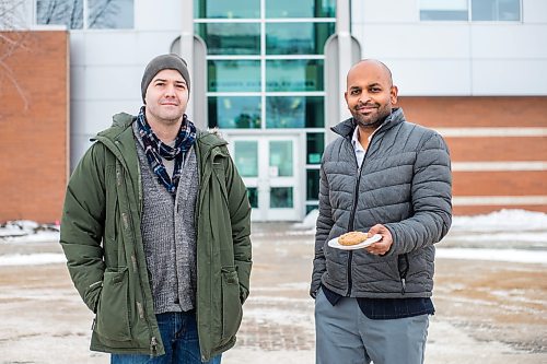 MIKAELA MACKENZIE / WINNIPEG FREE PRESS

Dylan MacKay (left) and Dr. Sijo Joseph pose for a portrait with some of the cookies in the study in front of the Richardson Centre for Functional Foods and Nutraceuticals in Winnipeg on Wednesday, Dec. 8, 2021. They are conducting a nutritional study using breakfast cookies made from oats containing beta-glucan, and will be looking at whether beta-glucan from oats has any effect on blood pressure. For Sabrina story.
Winnipeg Free Press 2021.